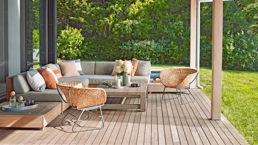 Modern front deck idea with low-profile wooden deck, outdoor sectional seating, and minimalist decor.