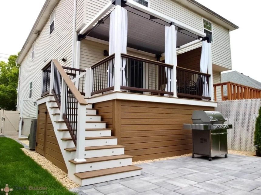 Light gray composite deck with black wicker patio furniture near pool, built by composite decking builders in Downers Grove, IL