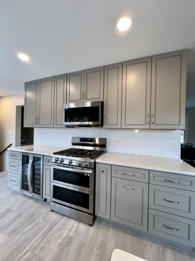 A stunning modern kitchen remodel in Naperville featuring custom cabinetry, quartz countertops, and carefully selected interior 