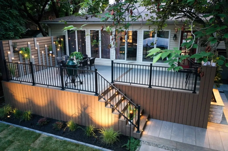 Elevated composite deck with outdoor lighting and black aluminum railing in Oak Brook Illinois