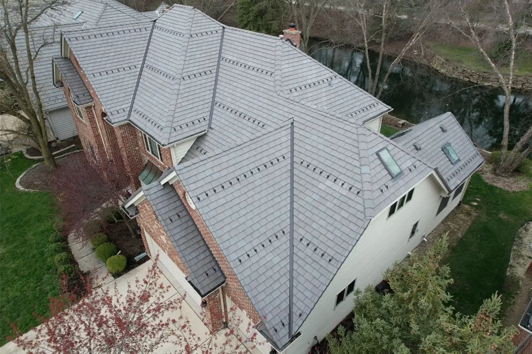 Completed asphalt shingle roof replacement on a residential home in Aurora IL by Naperville Roofing and Construction.
