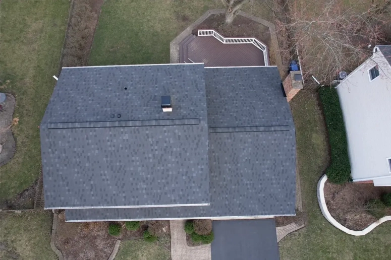 Aerial view of gray asphalt shingle roof replacement in Lombard IL completed by Naperville Roofing and Construction