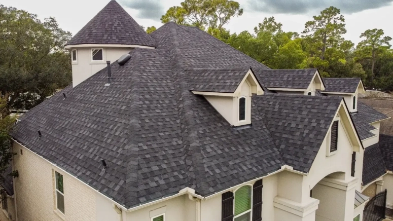 Architectural shingle roof replacement on luxury home in Wheaton Illinois completed by Naperville Roofing & Construction